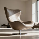 A modern ergonomic living room chair in refined matte leather, positioned as a functional sculpture in a sunlit minimalist interior, showcasing innovative design.