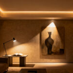 Modern living room demonstrating hierarchical lighting with ambient, task, and accent light layers, creating visual depth and defined zones.