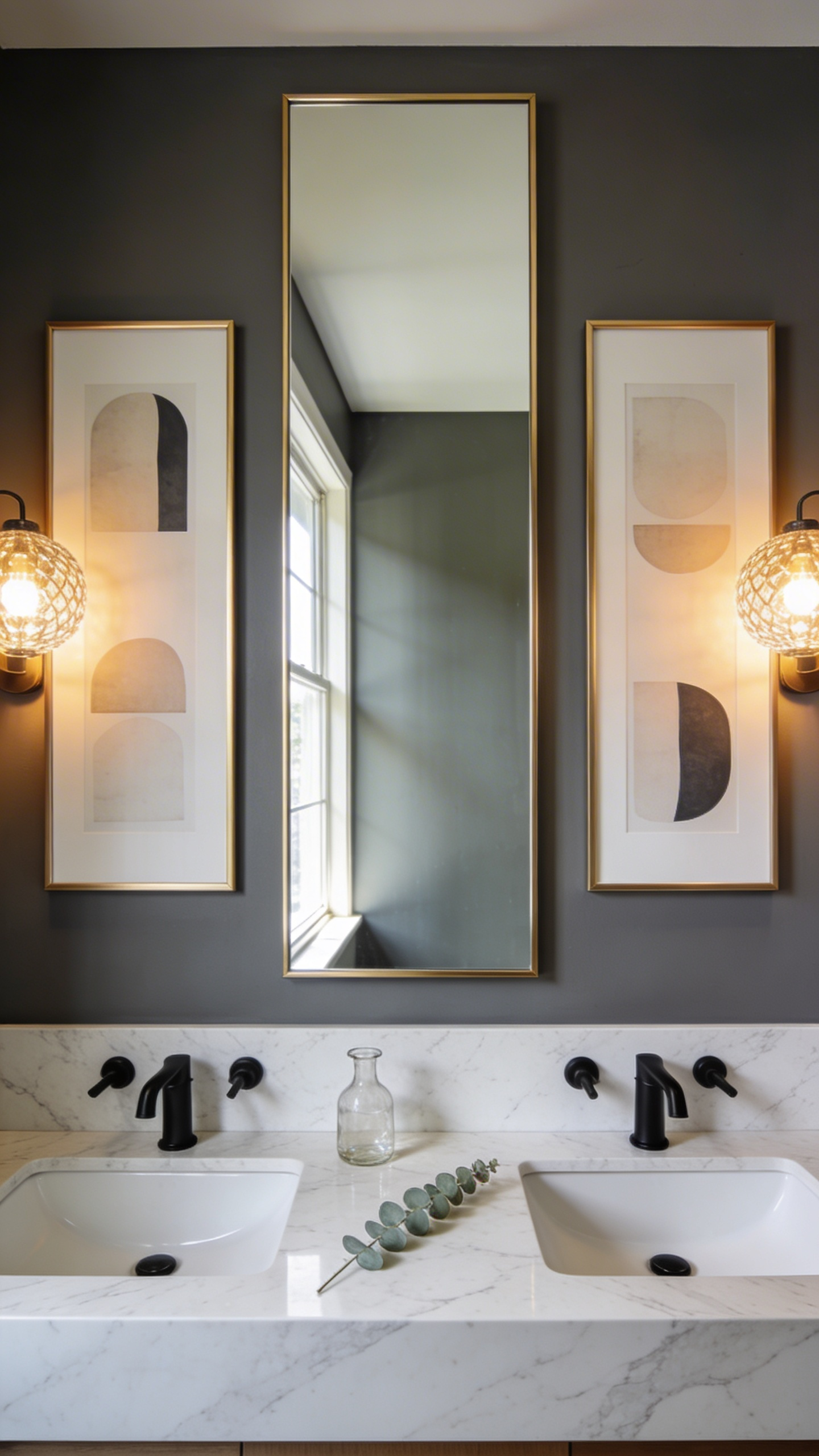 A modern bathroom vanity featuring two symmetrical abstract paintings framing a large central mirror on a dark gray wall.